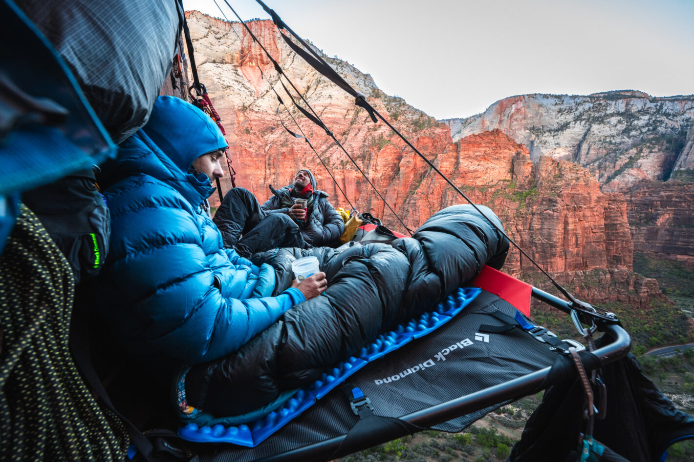 Climbers camping mid route, enjoying their incredible view before continuing to climb.